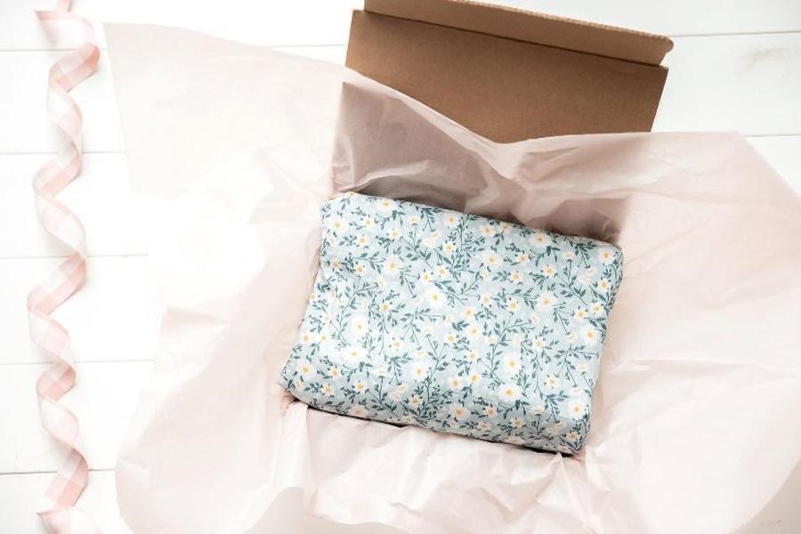 Corrugated cardboard box with tissue paper
