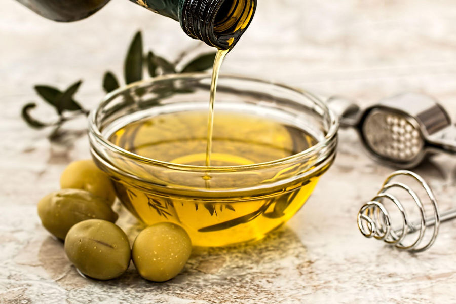 Glass jar filled with olive oil