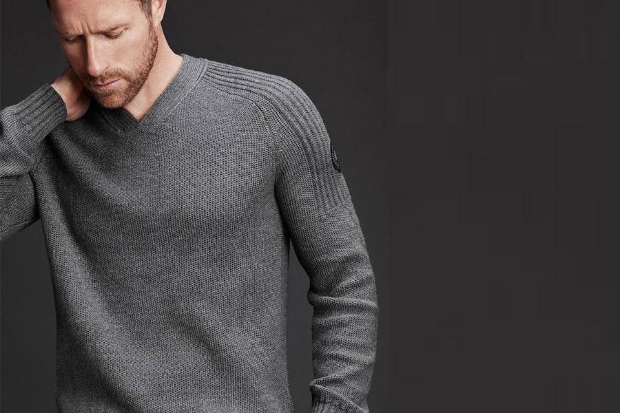 Male model rocking a gray sweater