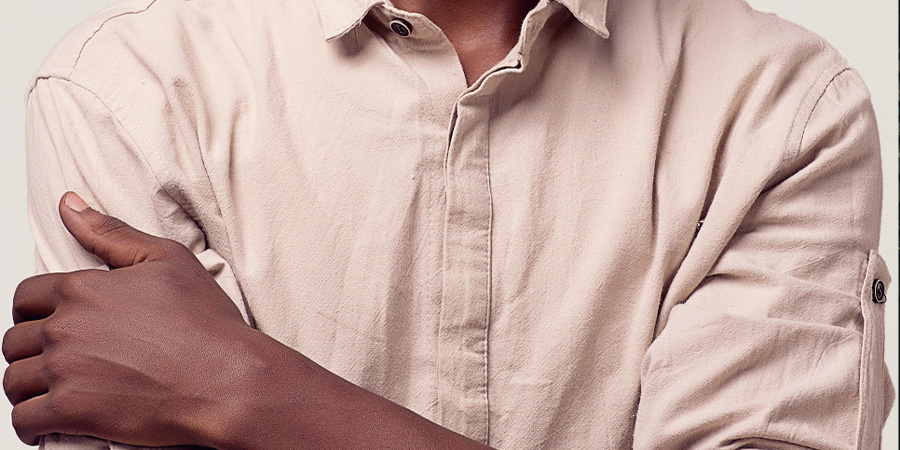Man in beige collar shirt with concealed buttons