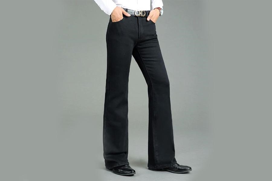 Man posing with jean flared trousers