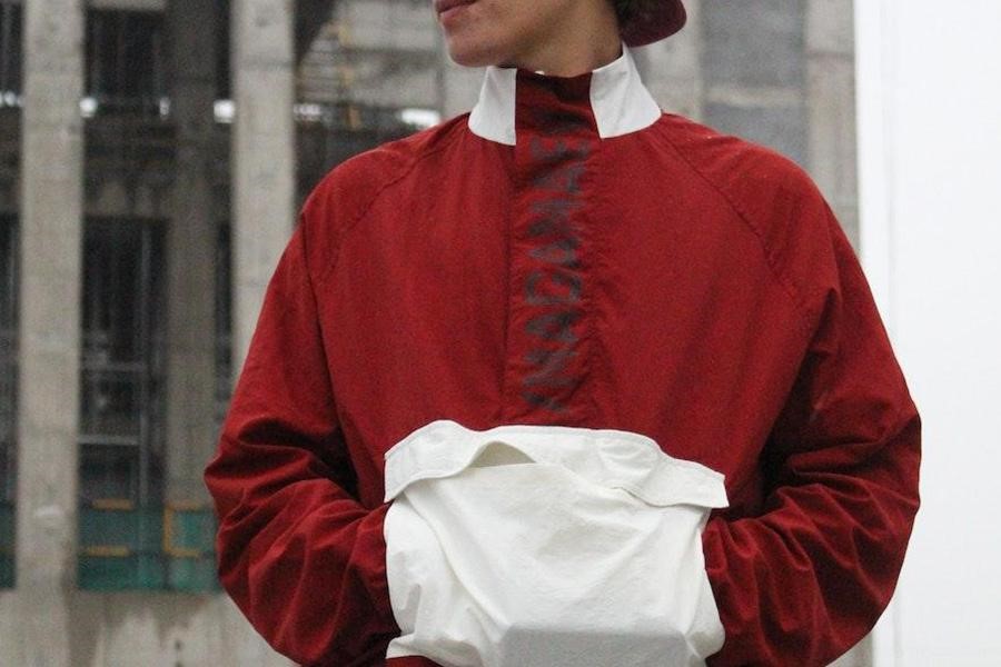 Man rocking a red coat with white designs