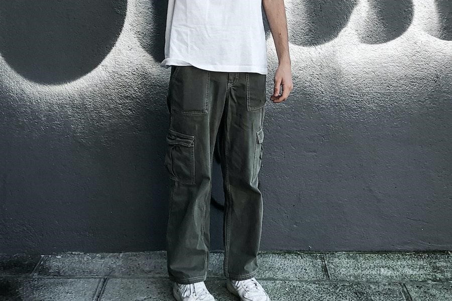 Man standing in grey cargo pants