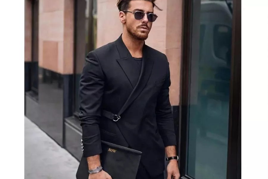 Man wearing a black wrap blazer