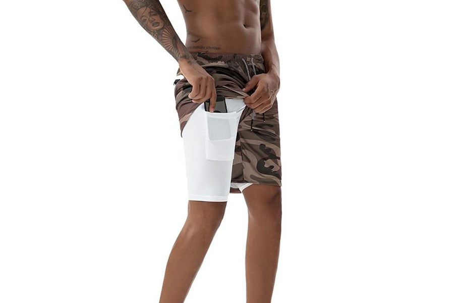Man wearing camouflaged double-layered shorts