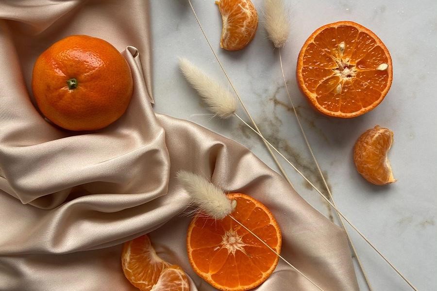 Oranges and tangerine on textile