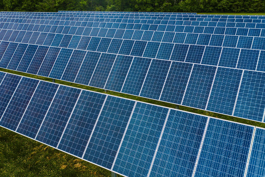 Solar panel array in a green field