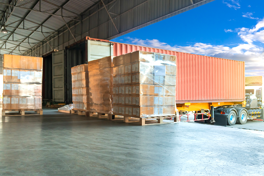 Warehouse and logistics transportation, cardboard boxes stacked or goods on pallets loaded onto trucks