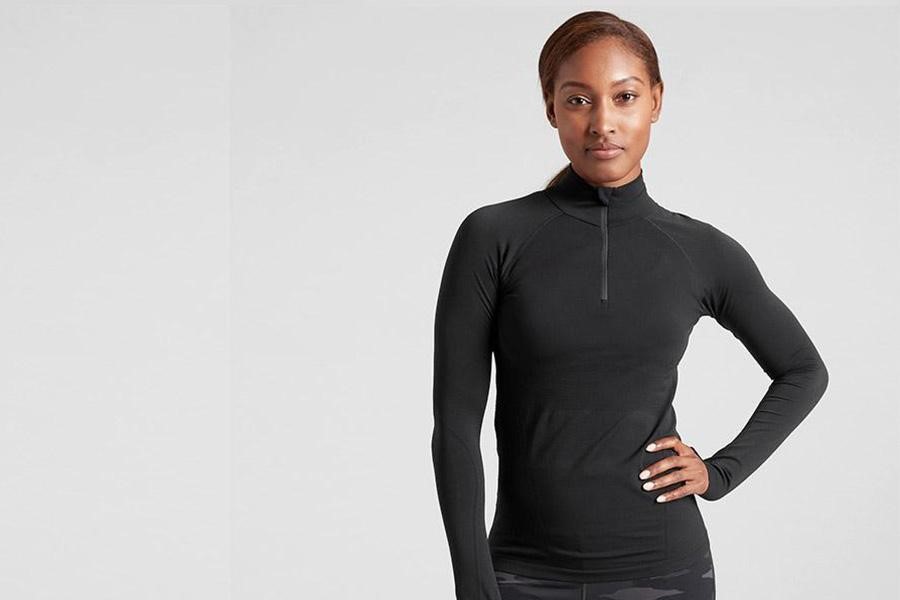 Woman wearing a black modest training top