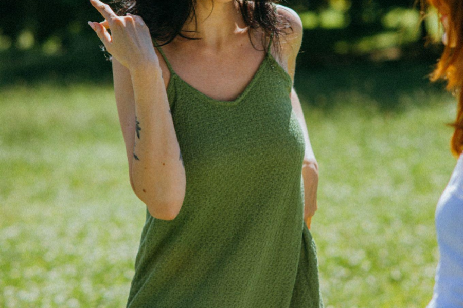 woman wearing a green color dress with thin straps