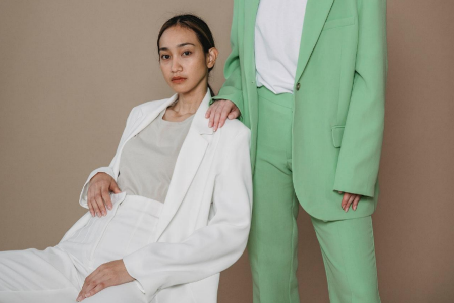 Women wearing white and green suits