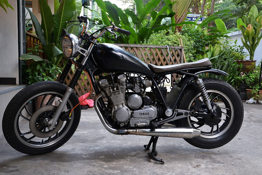 A cafe racer parked in a home compound 