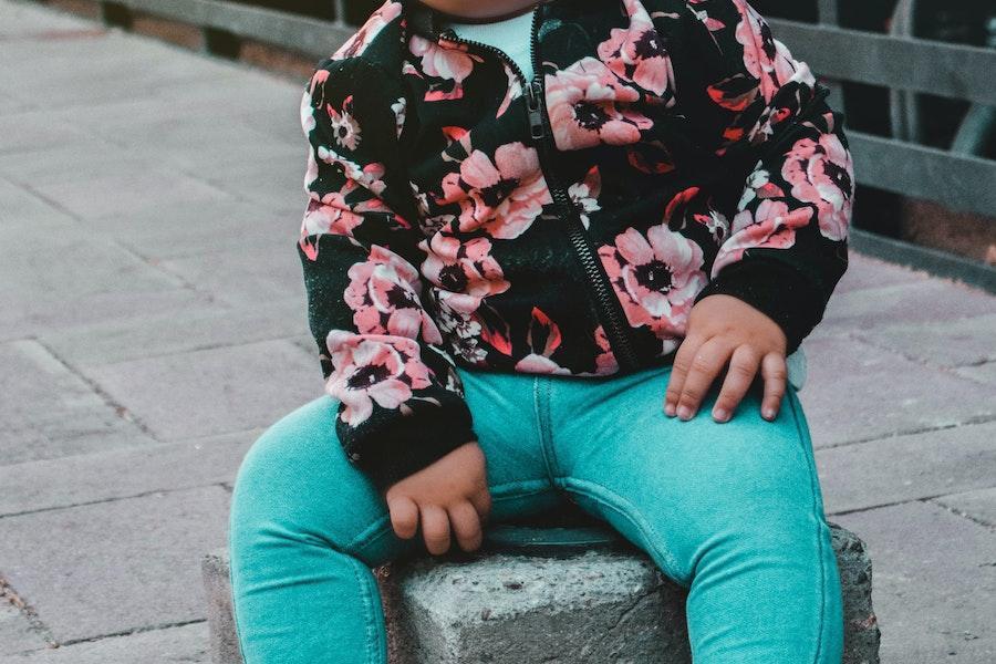 Anonymous kid posing with floral-pattern shacket