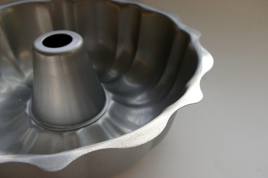 Empty bundt pan placed on grey surface
