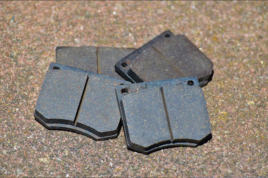 Fresh brake pads placed on a surface