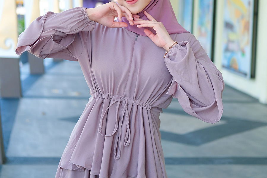 Hijab woman rocking a purple adjustable dress