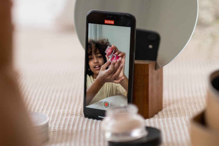 Image of a phone showing a makeup tutorial
