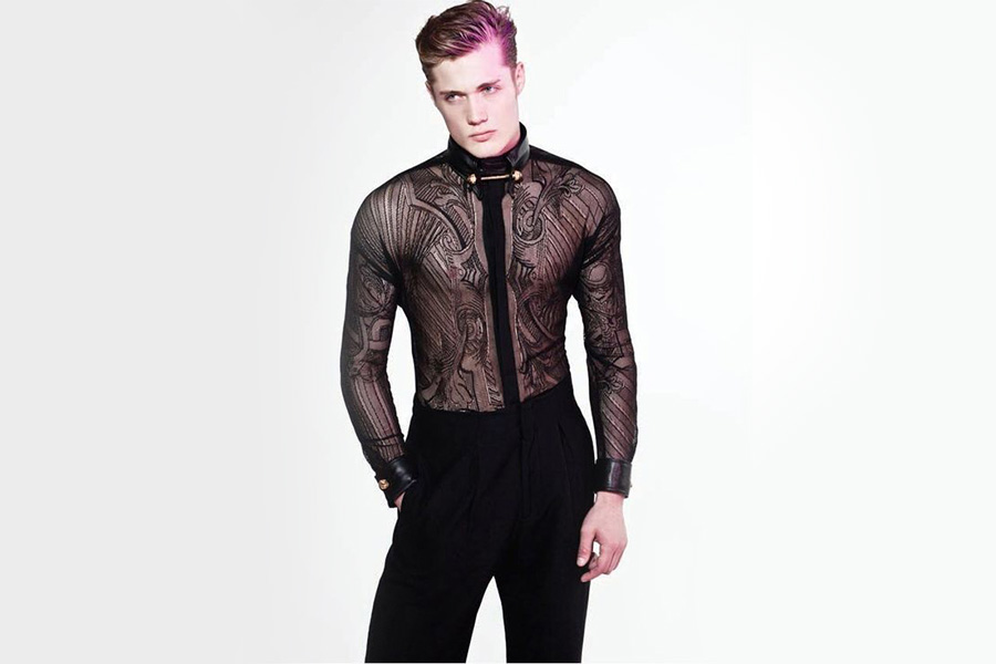 Man posing with long sleeve lace shirt