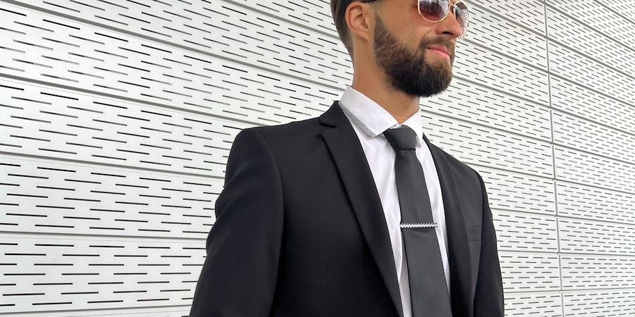 Man wearing sleek black tailoring