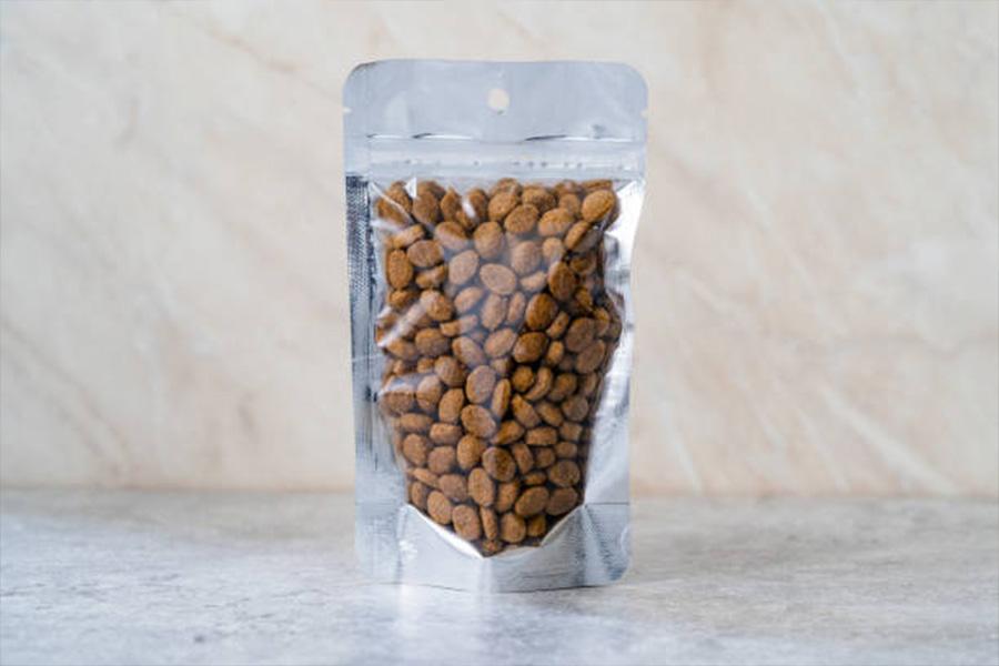 Small stand-up pouch with round pet treats inside the bag