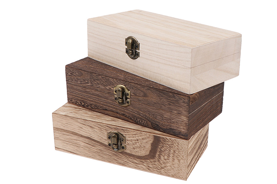 Three wooden boxes with vintage metal latches on the front