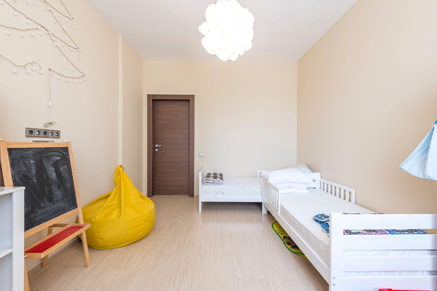 Two extended kid’s beds in a room