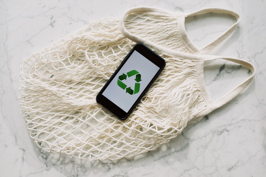 Weave bag under a phone with an eco-conscious symbol