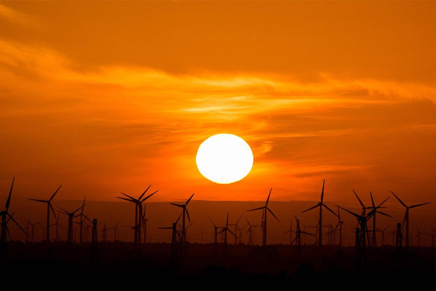 Wind turbines photographed during sunset