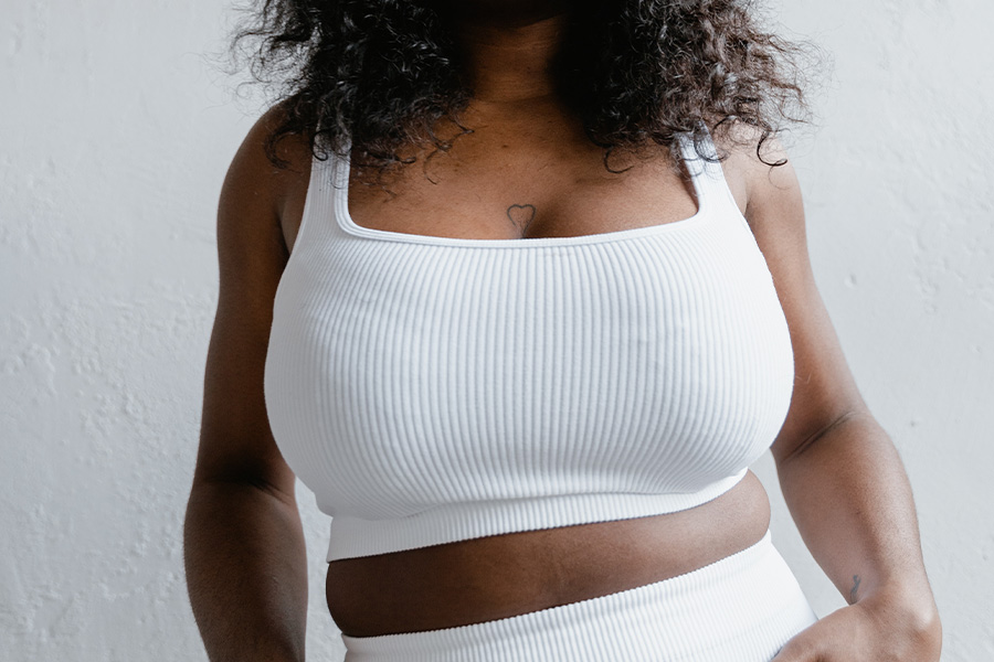 Woman posing with white cropped tank