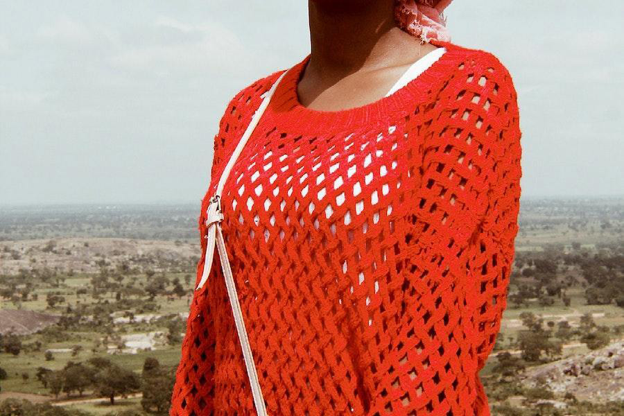 Woman rocking a red crotchet top