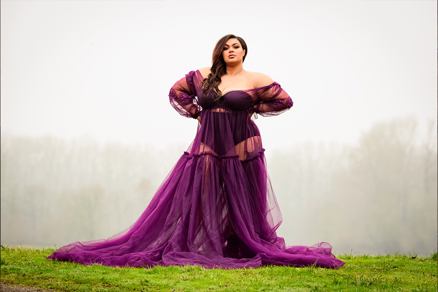 Woman wearing a voluminous purple dress made from tulle