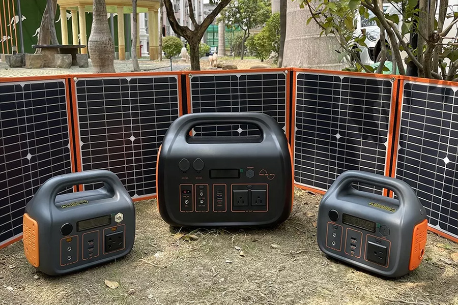 3 portable power stations in front of 5 solar panels