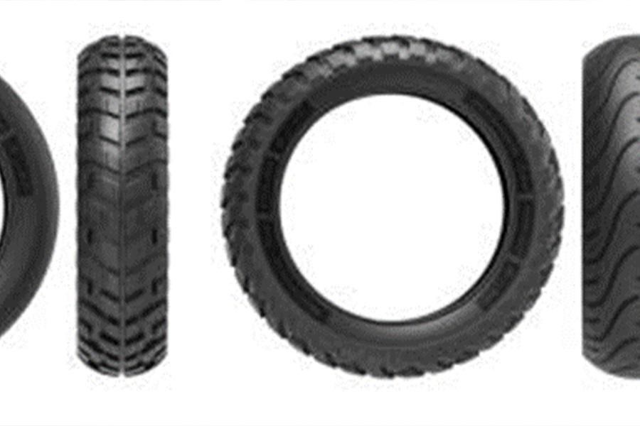 6 black motorcycle tires on a white background.