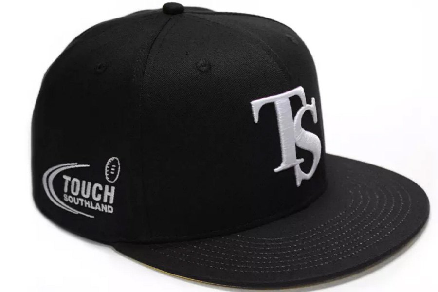 A black snapback hat with logo in white on front