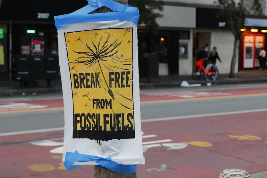 A sign displaying break free from fossil fuels