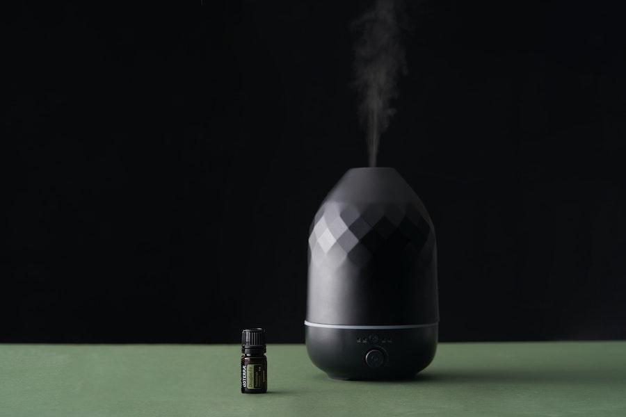 Aroma diffuser placed near essential oil