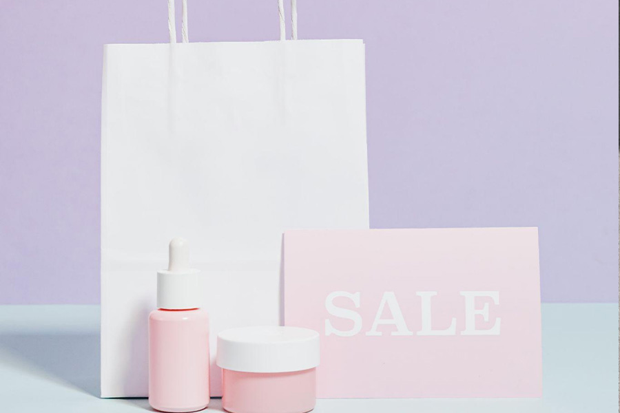 Beauty products displayed next to a sale sign