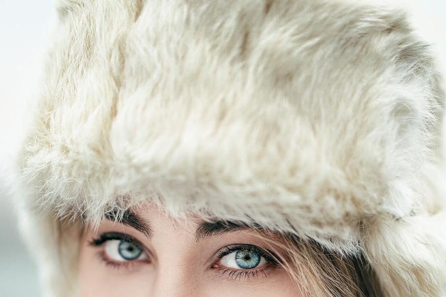 Close up shot of a woman in an ushanka hat