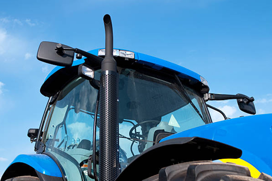 Close-up view of a new blue farm tractor cab