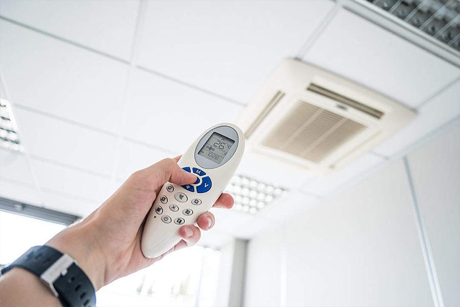Controlling office room temperature with air conditioning remote control