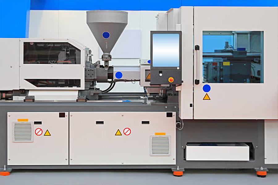Injection molding machine for thermoplastic polymers