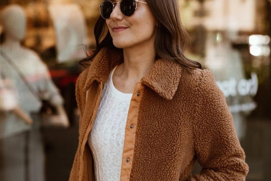 lady with shades wearing a brown micro-fleece jacket