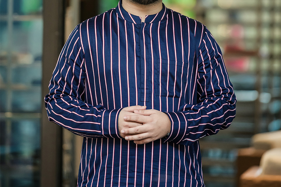 man in a striped tunic