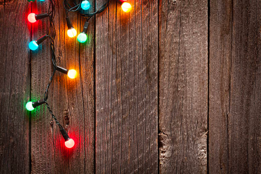 Multi-color Christmas lights on wood