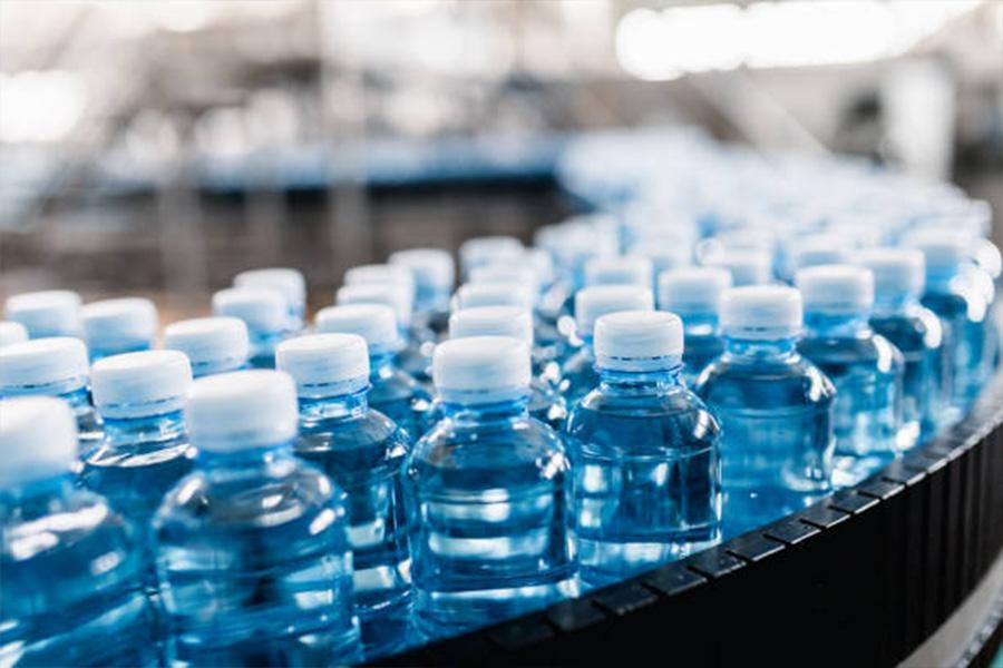 Plastic water bottles on assembly line