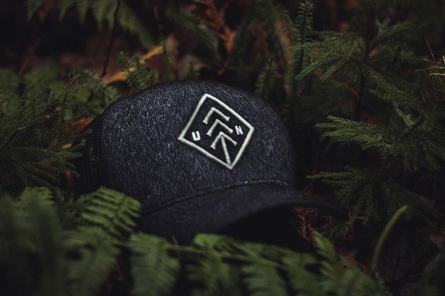 Printed snapback hat among some leaves