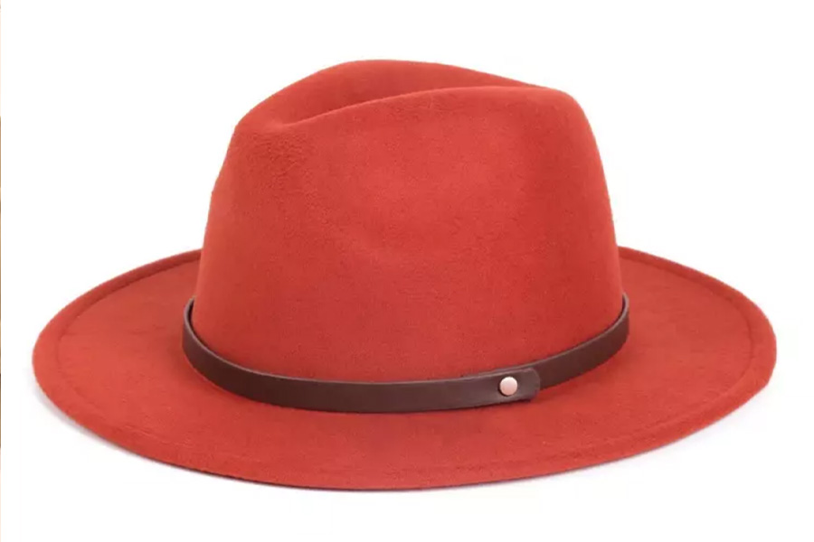 A red felt hat with a leather ribbon around it