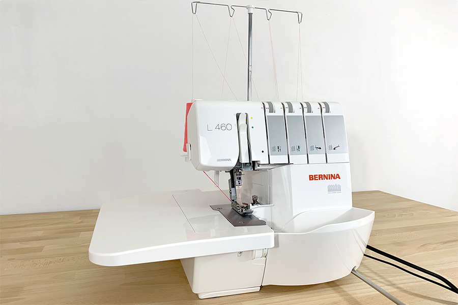 Serger sewing machine with thread prepped