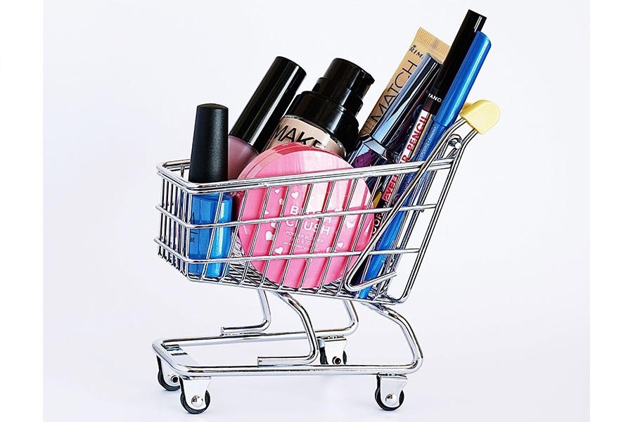 Shopping cart filled with makeup products