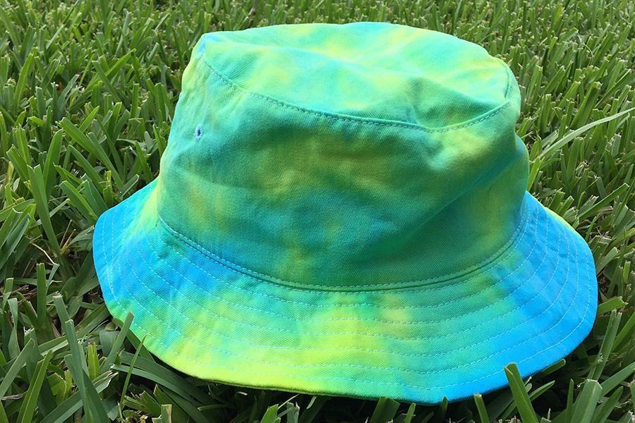 Tie-dye bucket hat placed on grass